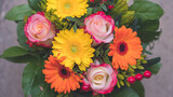 Greetings, anniversary or Mother’s Day concept: Close up of colorful fresh spring flower bouquet with gerbera and pink roses