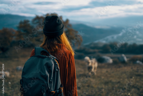woman hiker backpack travel mountains landscape trip