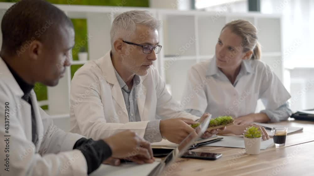 Team of biologists working on study Team of biologists working on study