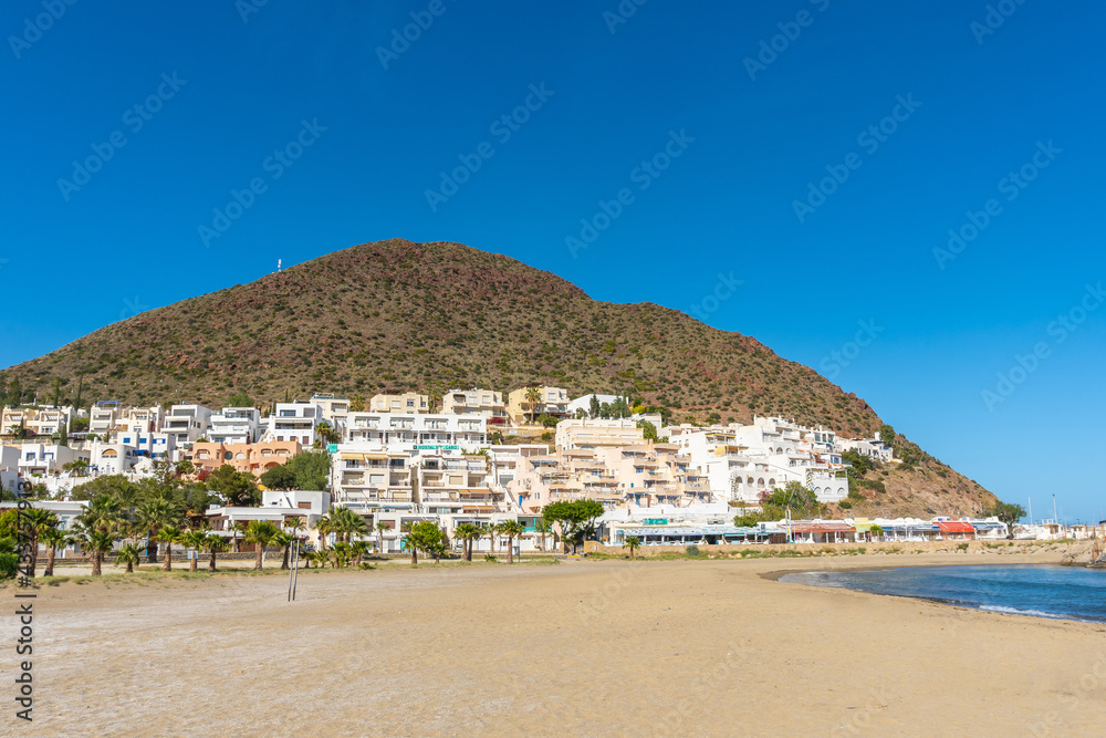 White house in the mountains on the beach of San Jose in the town of Nijar, Almería. Andalusian coast in Cabo de Gata. Spain