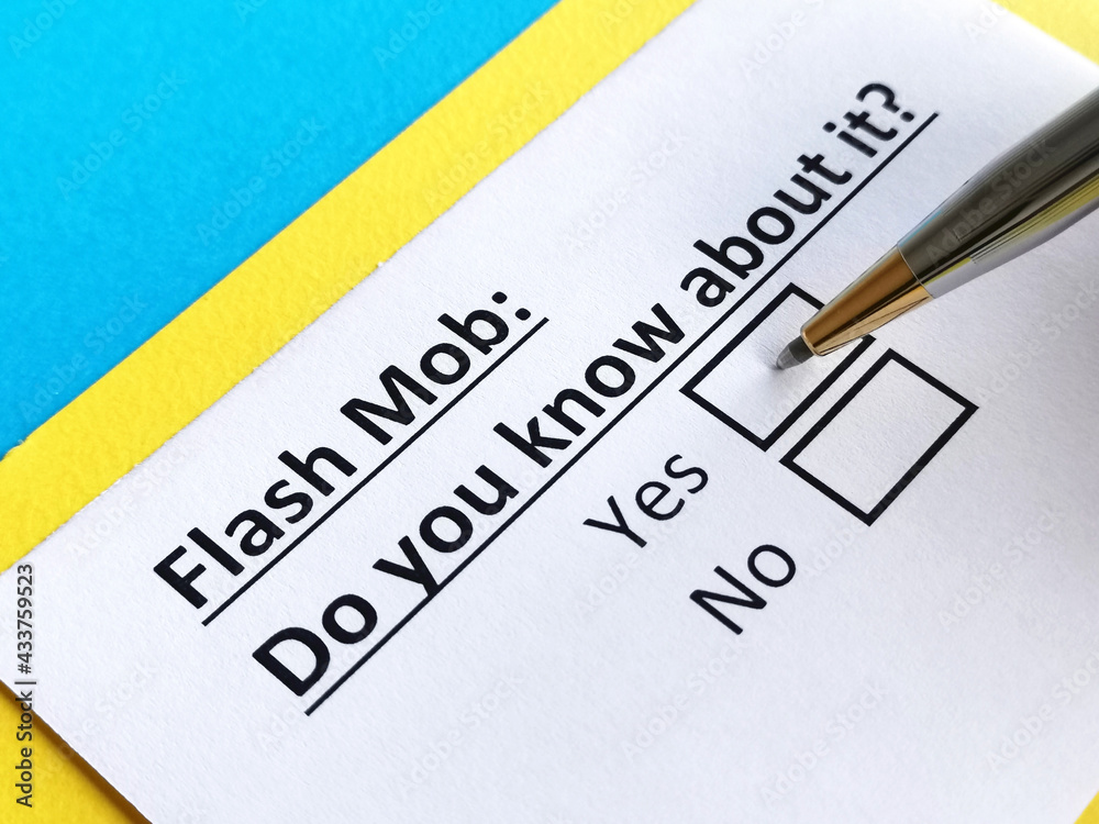 One person is answering question about flash mob. One person is answering question about flash mob.