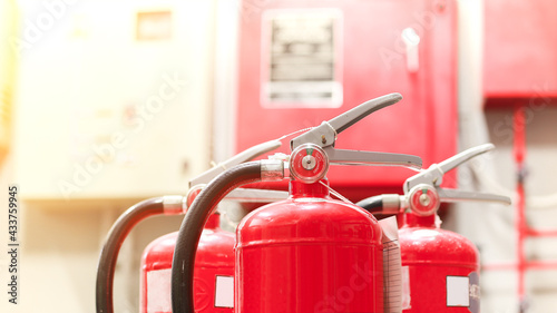 The red fire extinguisher is ready for use in case of an indoor fire emergency.