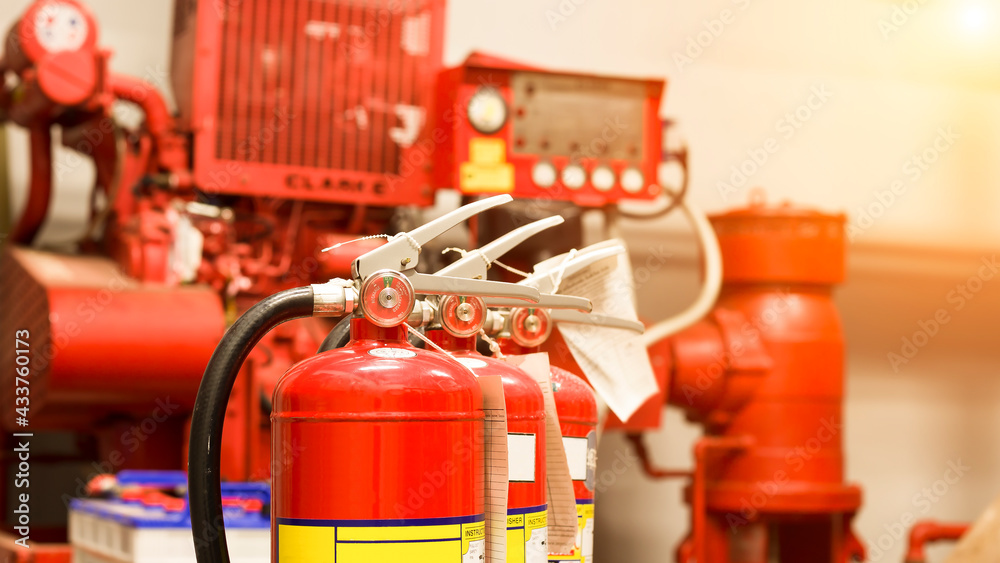 The red fire extinguisher is ready for use in case of an indoor fire emergency.