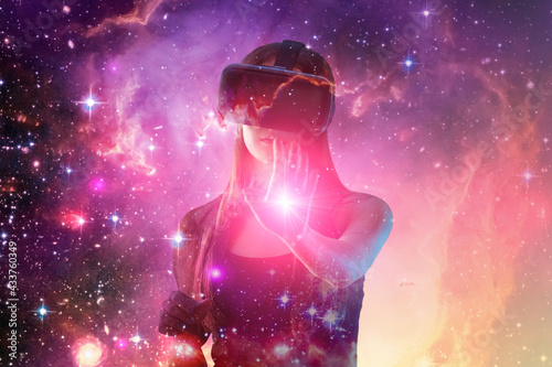 Neon gamers,virtual reality, girl in vr helmet in space galaxy, woman playing video game in glasses,Element of the image provided by NASA