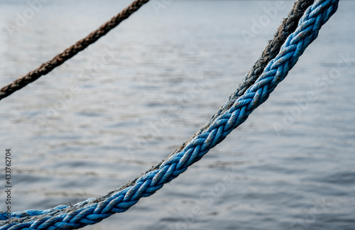 Several ropes in the background of calm water (816) © Maayan