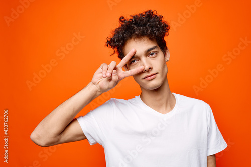 guy with curly hair gestures with his hand emotions modern style