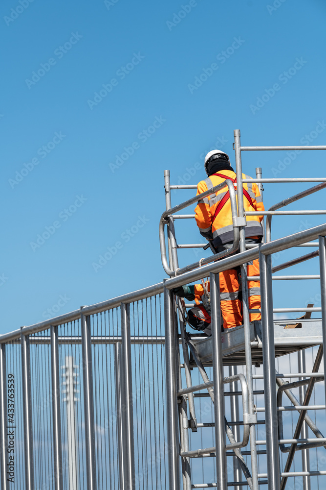 Workers working on scaffolding