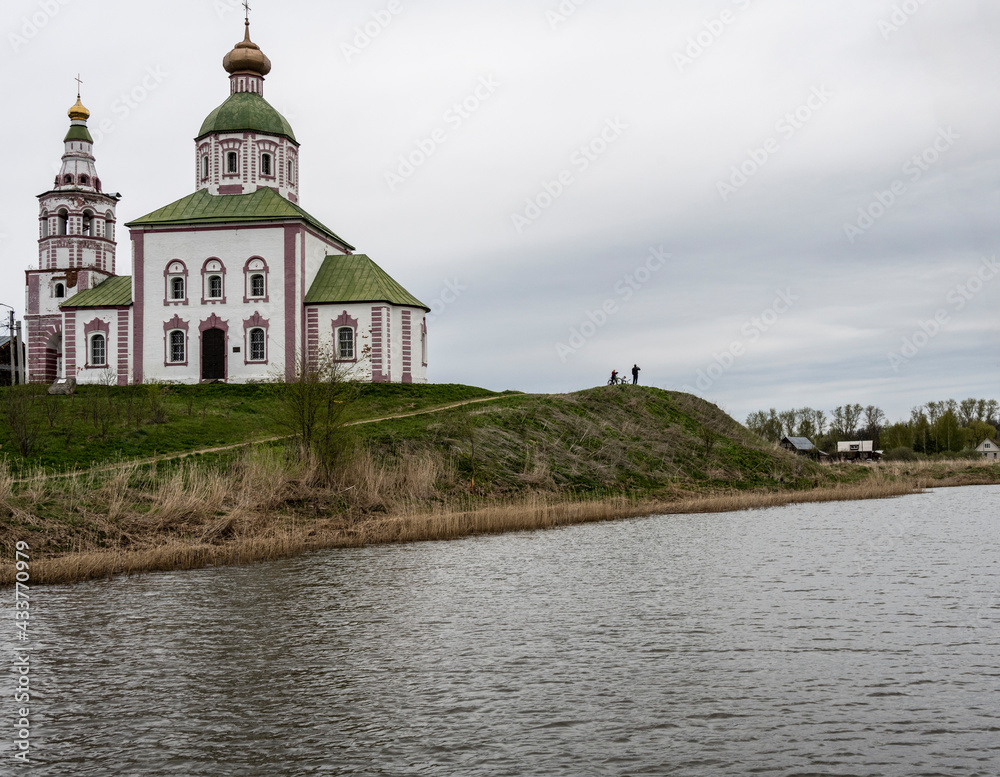 monasteries and fortresses of old Suzdal against the backdrop of a green river