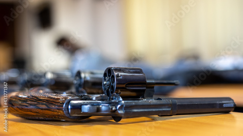 Close-up shot of .38 revolvers lined up.