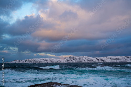 Cloudy weather conditions in the Arctic region, natural scenery along the Arctic Ocean. Winter nature background picture.