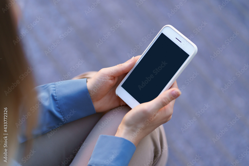 Close up woman hands holding smartphone with black screen Close up woman hands holding smartphone with black screen