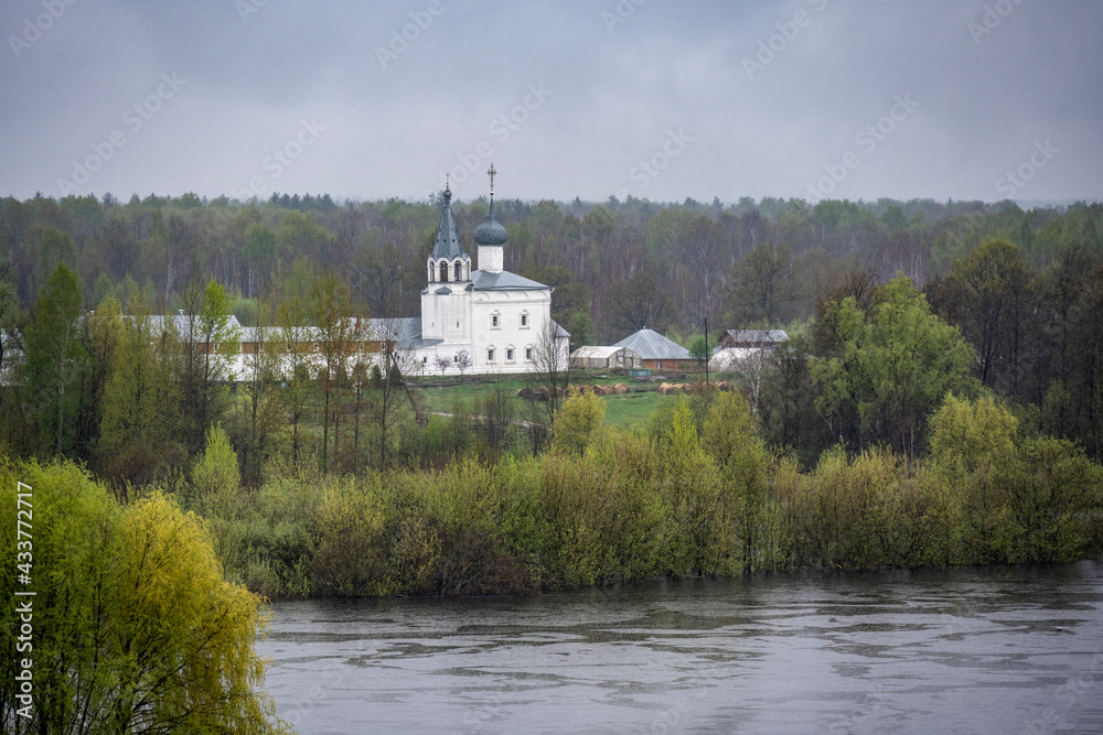 Fototapeta premium cityscape of the old center of Gorokhovets with churches, temples and houses in the rain