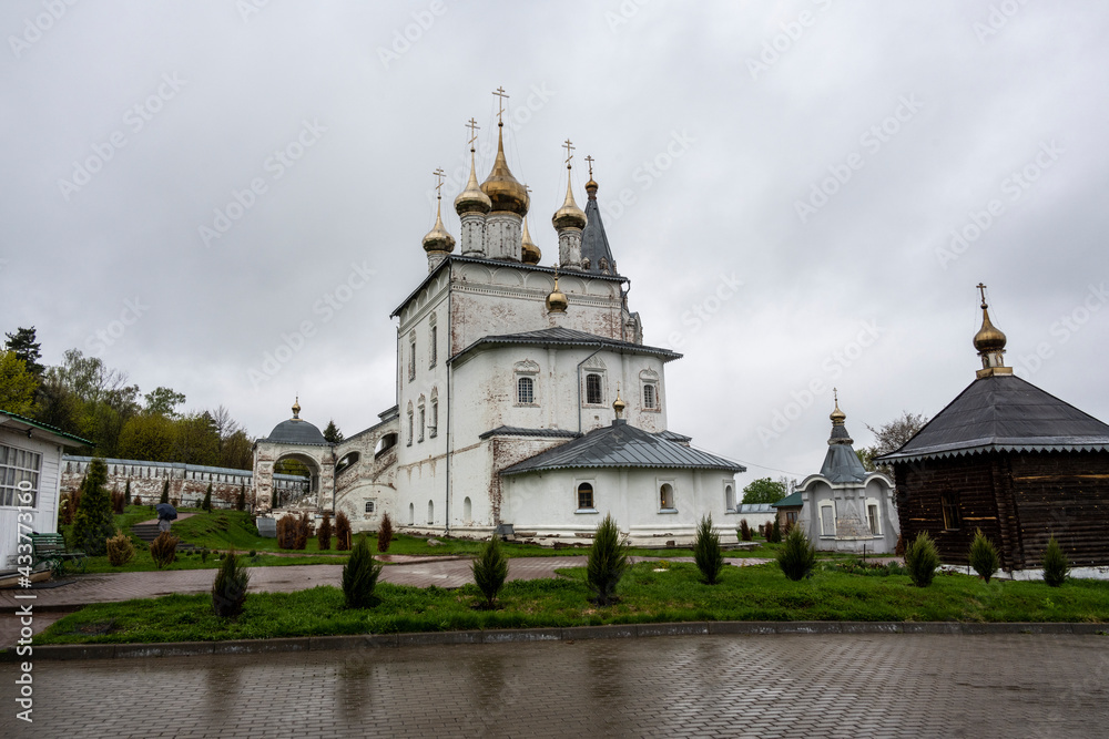 cityscape of the old center of Gorokhovets with churches, temples and houses in the rain