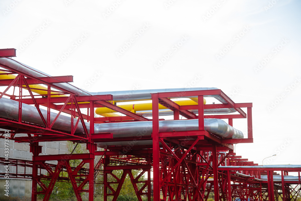 Steel pipelines, valves and ladders in an industrial enterprise Steel pipelines, valves and ladders in an industrial enterprise