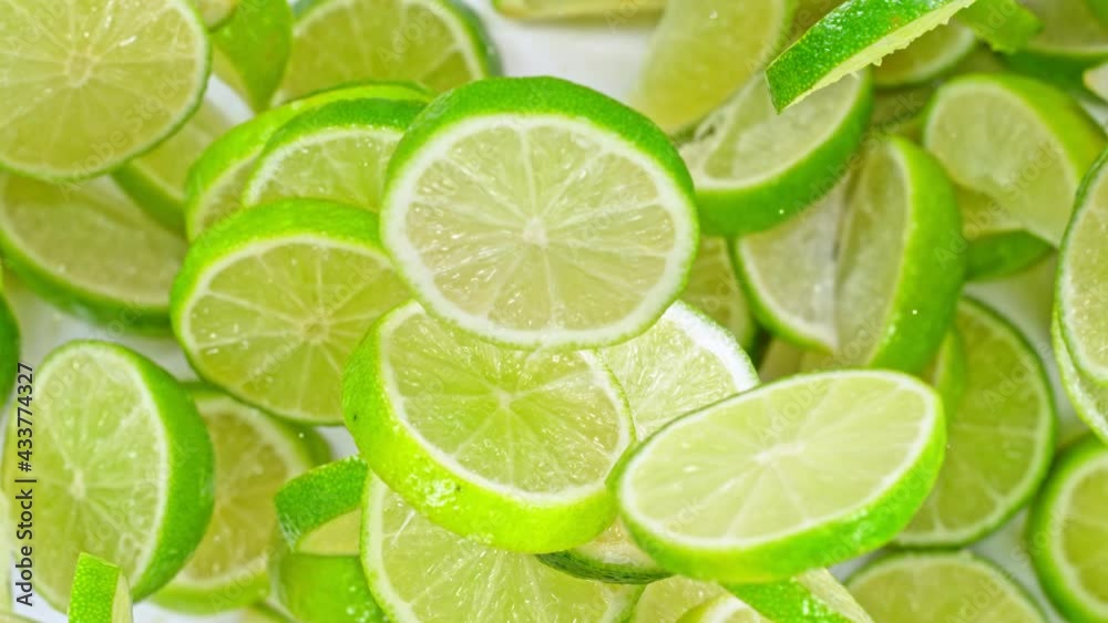 Super Slow Motion Shot of Flying Fresh Lime Slices Towards Camera at 1000fps. Super Slow Motion Shot of Flying Fresh Lime Slices Towards Camera at 1000fps.