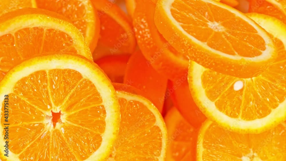 Super Slow Motion Shot of Flying Fresh Orange Slices Towards Camera at 1000 fps. Super Slow Motion Shot of Flying Fresh Orange Slices Towards Camera at 1000 fps.