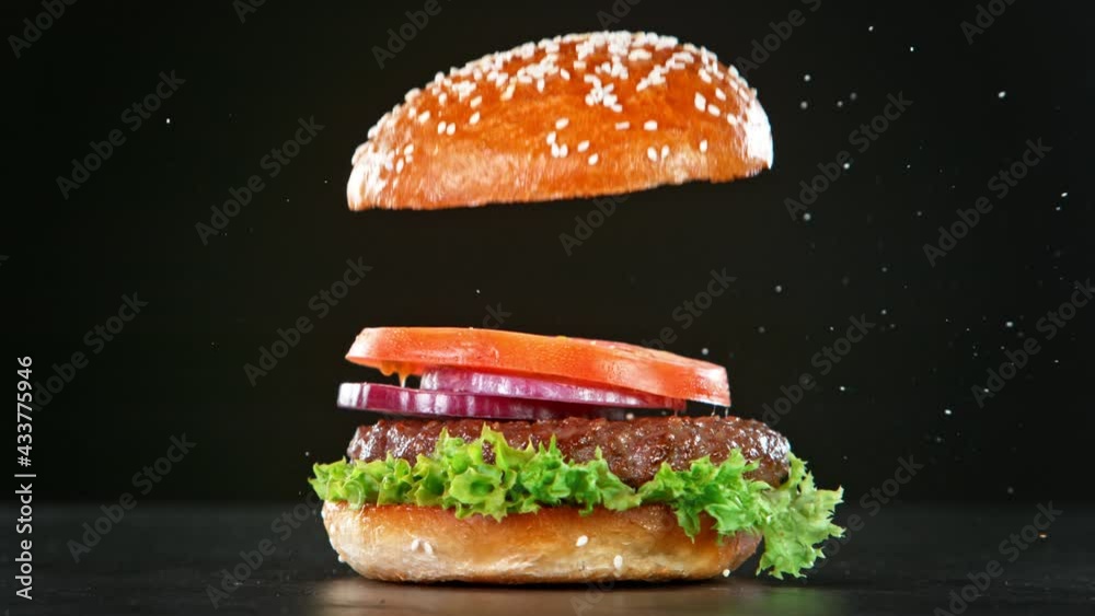Super Slow Motion Shot of Falling and Stacking Parts of Hamburger at 1000fps.