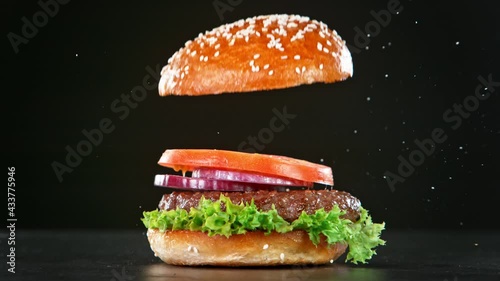 Super Slow Motion Shot of Falling and Stacking Parts of Hamburger at 1000fps.