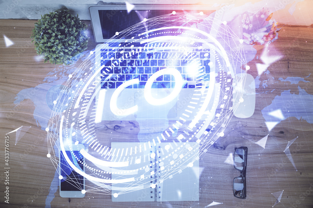 Blockchain theme hologram drawings over computer on the desktop background. Top view. Double exposure.