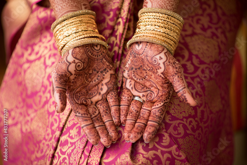 Female hands showing henna tattoos