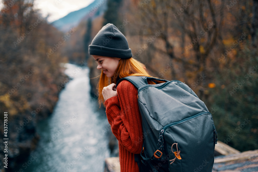 woman with backpack in forest autumn river nature landscape woman with backpack in forest autumn river nature landscape