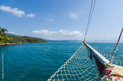Detail of the bow of the boat with the sea of Paraty in the background, trips around Rio de Janeiro on sunny days