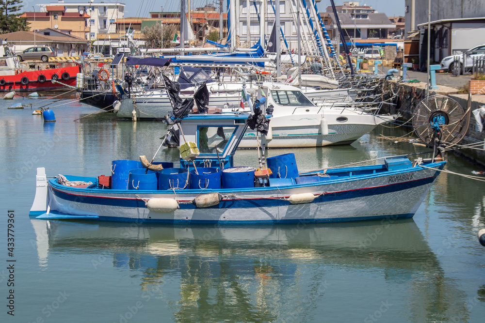 Small Blue and white fishing boat with Ultrasonic equipment for fishing boats,at Fiumicino port, Lazio, Italy 