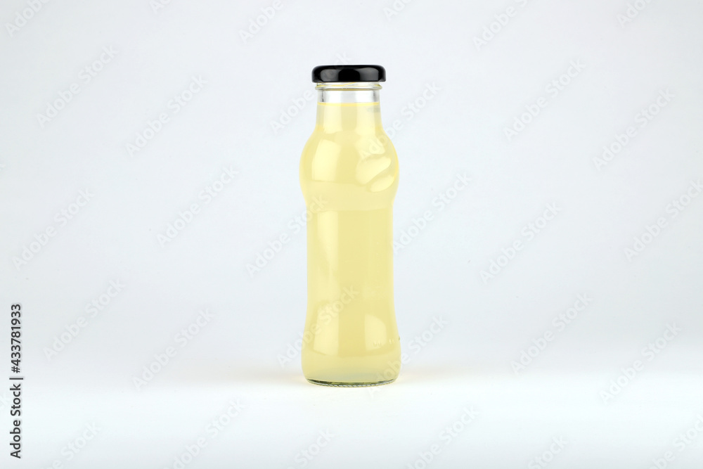 Glass fruit juice bottle isolated on white background. Glass fruit juice bottle isolated on white background.