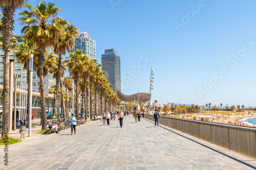 Picture of Barceloneta seafront promenade captured during a sunny day. photo
