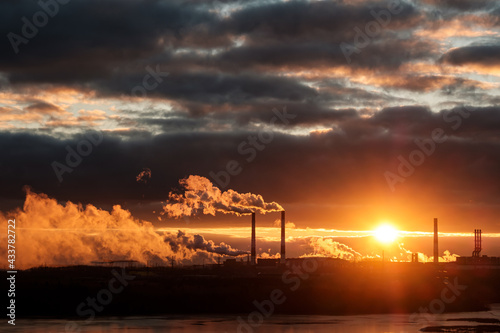 man-made landscape during sunset  chimneys from the enterprise