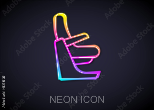 Glowing neon line Airplane seat icon isolated on black background. Vector