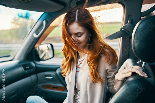 woman in front seat of car turned back and window design salon travel companion travel tourism