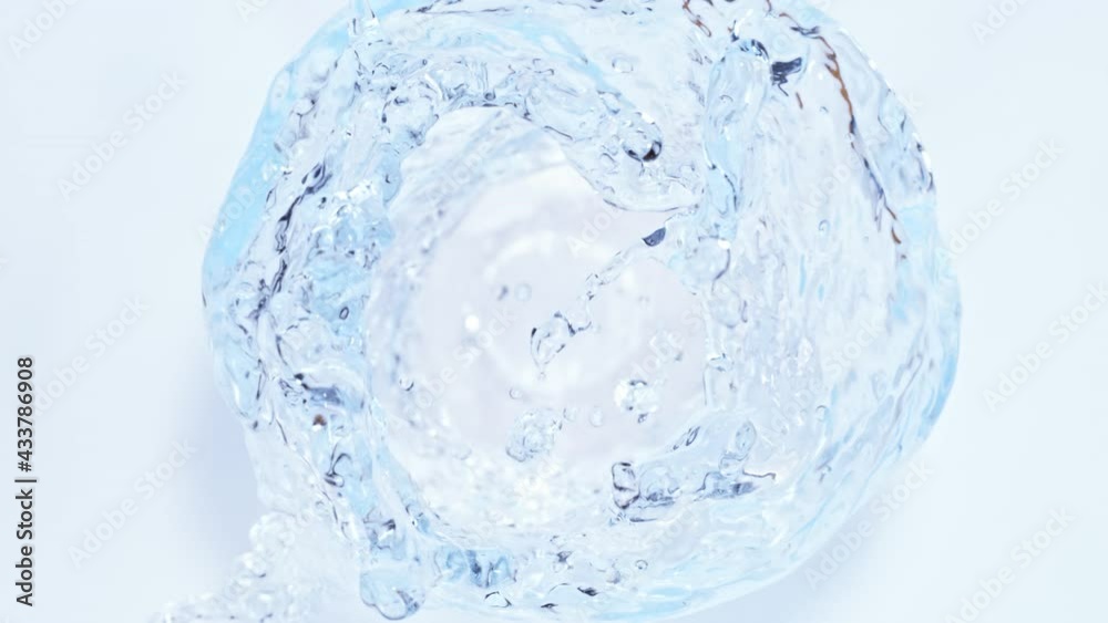 Super Slow Motion Shot of Water Vortex Splash Isolated on Light Blue Background at 1000fps. Super Slow Motion Shot of Water Vortex Splash Isolated on Light Blue Background at 1000fps.