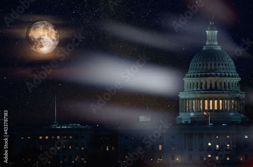 United State Capitol building in the lighth of full super moon in a starry night sky. Elements of this image furnished by NASA.