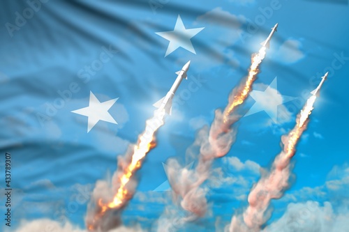 Modern strategic rocket forces concept on blue sky background, Micronesia supersonic missile attack - military industrial 3D illustration, nuke with flag photo