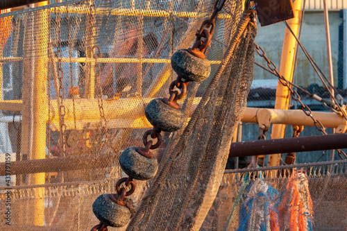 Commercial fishing nets hanging from fishing boat