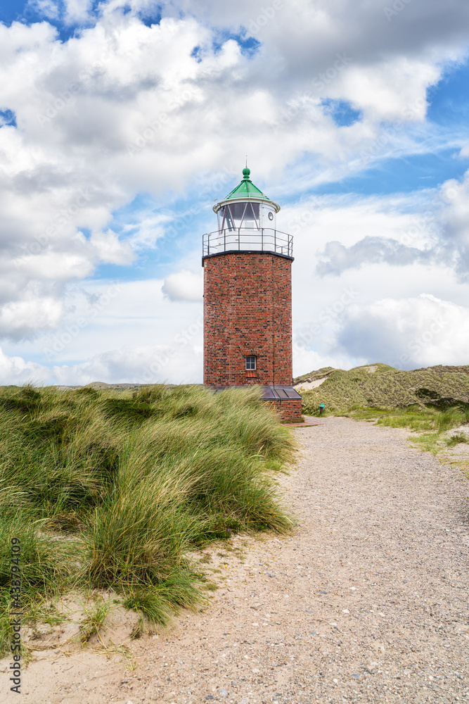 Fototapeta premium Brick lighthouse on dune. Sylt.
