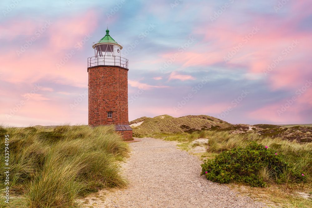 Brick lighthouse on dune. Sylt. Brick lighthouse on dune. Sylt.