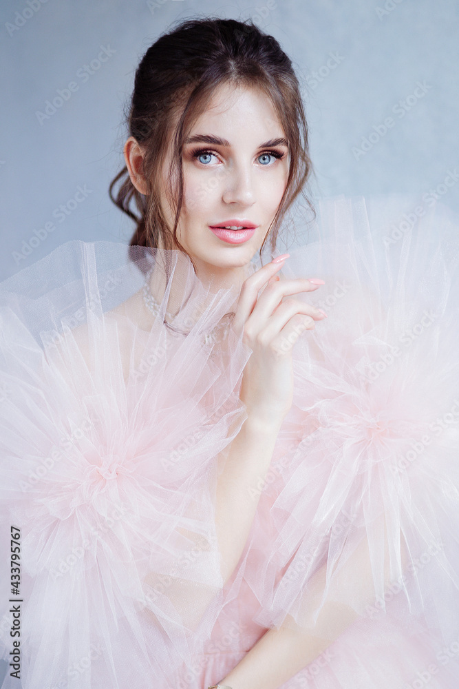 Mysterious young woman in elegant beautiful airy luxury evening trendy dress Mysterious young woman in elegant beautiful airy luxury evening trendy dress