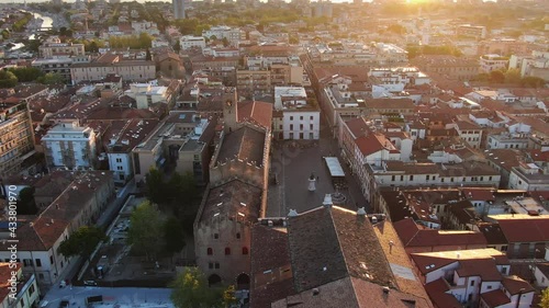 rimini historic city centre aerial view drone flying over cavour square at sunrise dawn photo
