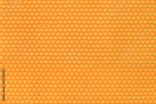 Fabric texture canvas. Cotton background. Detail close up for dress or other modern fashion textile print. Orange textured design.