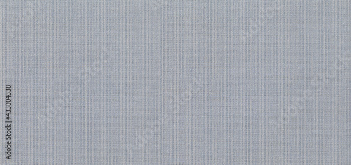 Fabric texture canvas. Cotton background. Detail close up for dress or other modern fashion textile print. Gray and blue textured design.