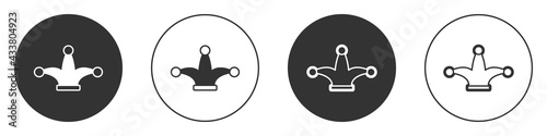 Black Joker playing card icon isolated on white background. Jester hat with bells. Casino gambling. Circle button. Vector