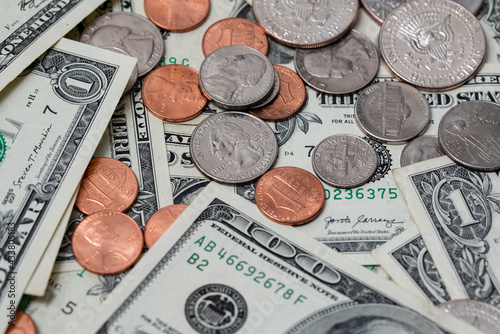 Dollar coins and banknotes, US dollar currency. Economy of the United States of America, income and expenses concept