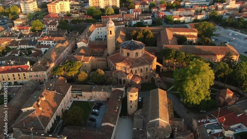 ravenna city centre aerial view at sunrise dawn drone flying backwards over basilica of san vitale