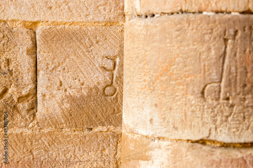 Key-shaped stonework symbol on the wall of the 12th century Cistercian monastery of Santa María de Moreruela. Zamora, Castilla y León,  Spain. photo