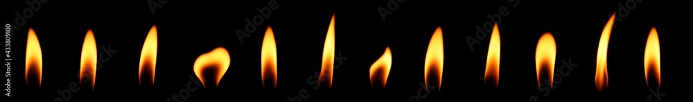set candle flame is burning At night at close range isolated on black background