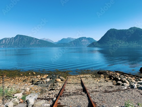 Nordic landscape, view of the sea and mountains, islands and horizon, fjord, blue sky, sunny day