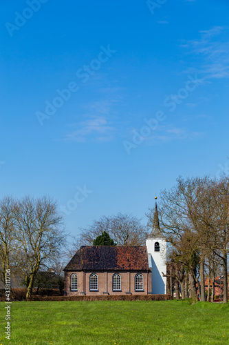 Landscape with white protestant church in Roderwolde in municipality Noordenveld in Groningen The Netherlands photo