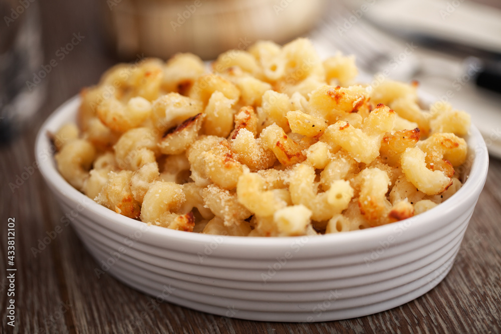 mac and cheese, macaroni pasta in cheesy sauce - American style mac and cheese, macaroni pasta in cheesy sauce - American style